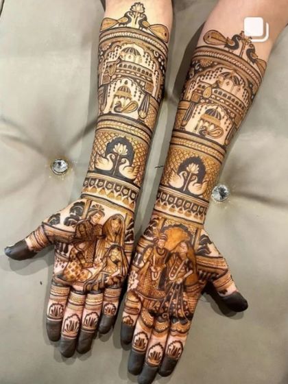 A classic bride and groom design, this mehandi features the couple in traditional wedding attire, surrounded by palace and elephant motifs.
