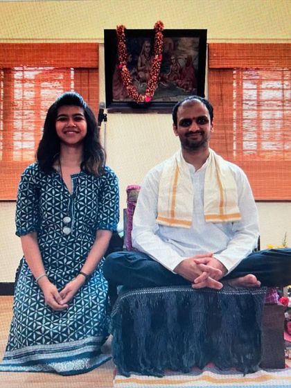 With my teacher, Sharathji. His presence shaped my life, and the gift of this practice he bestowed upon us is eternal. He will always be our teacher.