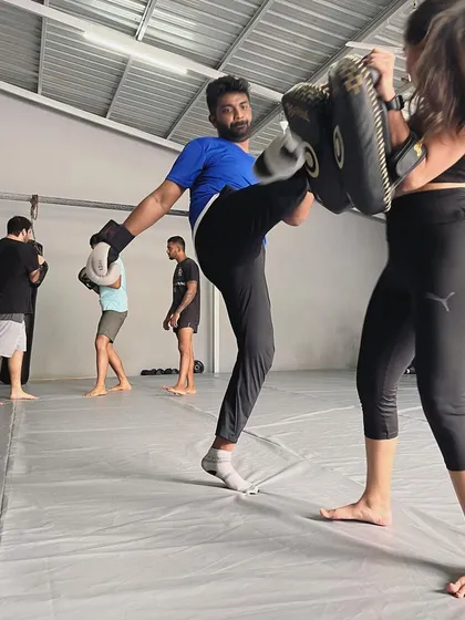 Another angle of a member executing a clean kick.