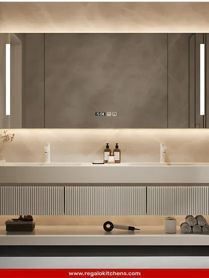 A wide, floating double vanity with a fluted front and an illuminated shelf below. The large mirror includes integrated vertical lighting for a shadow-free reflection.
