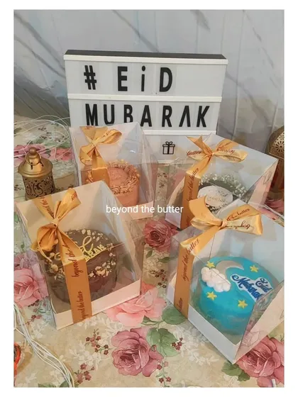 My Eid bento cakes, all dressed up in their special gift packaging. The clear boxes are tied with a gold ribbon, making them a beautiful and ready-to-give Eidi.