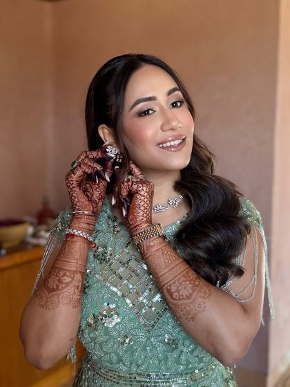 Soft glamour for a stunning shade of green. This bride's Welcome Lunch look at Suryagarh was all about fresh, glowing skin and a soft, shimmery eye that made her look effortlessly chic.