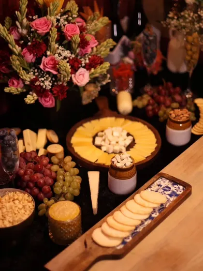 An overhead view of the cheese and fruit board at the AOM Couture event. This spread highlights our attention to detail in creating visually stunning and delicious grazing tables.