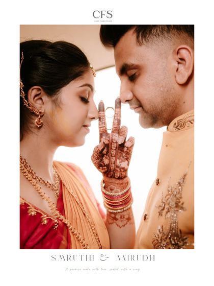 A promise sealed with a ring. This creative shot frames the couple's faces with their hands, drawing attention to the ring and their emotional connection.