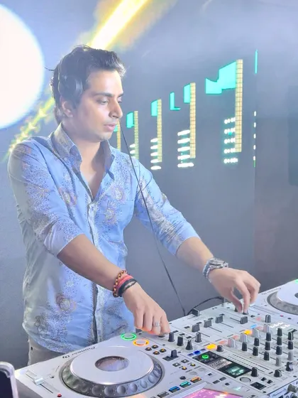 Caught in the act at a white party. In this moment, I'm completely focused on the mix, feeling the rhythm before I share it with the crowd.