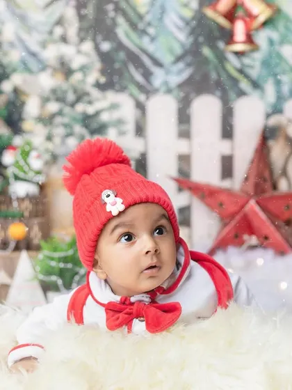 Looking up at the magic of Christmas. This pose captures the sense of wonder that makes this time of year so special for children.