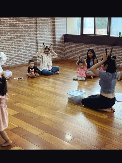 Look at this creative use of claves. We're pretending they are bunny ears. Using imagination during instrument play makes the experience more fun and memorable.