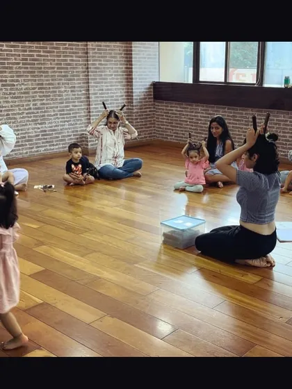 Look at this creative use of claves. We're pretending they are bunny ears. Using imagination during instrument play makes the experience more fun and memorable.