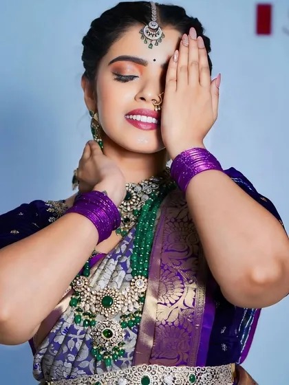 The model's pose highlights the beauty of the long Victorian haram and the matching waist belt.