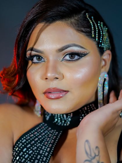 The final look: a bold, graphic eyeliner with rhinestone details, perfect for a Bollywood-style glam night.