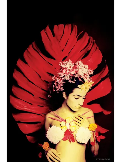 Floral embrace, nature's muse. An experimental portrait shot on infrared film, which creates a surreal, dreamlike quality with unique colors and tones.