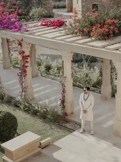 A quiet moment for the groom amidst the beautiful architecture and bougainvillea-laden pergolas of Suryagarh. We ensure our couples have moments of calm to soak in the beauty of their surroundings.
