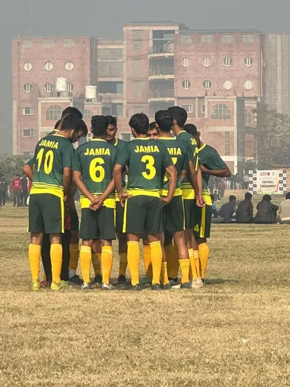 More than just a team, we build a unit. Our football players strategizing together, showcasing the teamwork and unity we instill in all our athletes before they take the field.