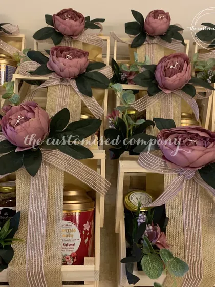 This image captures the rustic elegance of my wooden crate hampers for Diwali. I love combining natural textures with beautiful floral arrangements and premium goodies to create a truly sophisticated gift.