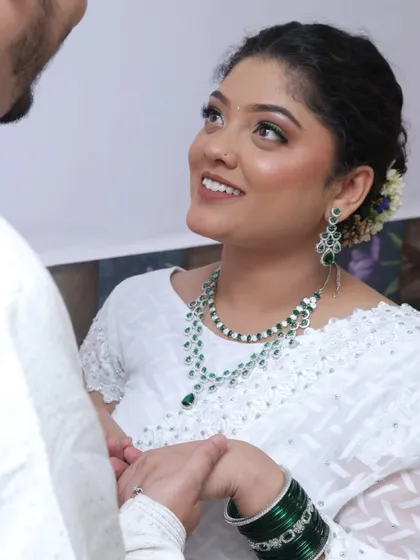 The green AD set was a perfect match for her beautiful white saree.