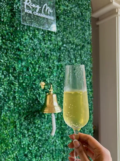 It's the little details that create a memorable experience. Our playful "Ring for Champagne" wall is more than just a feature; it's an invitation to celebrate, indulge, and enjoy the seamless, attentive service we are known for.