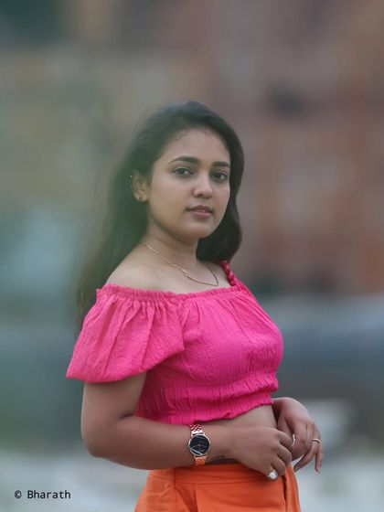 A simple and beautiful outdoor portrait. The soft lighting and direct gaze create a connection with the viewer.