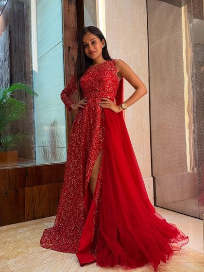 Posing for a quick photo before the main event begins. This stunning red gown made me feel powerful and ready to own the stage for a memorable wedding gig.