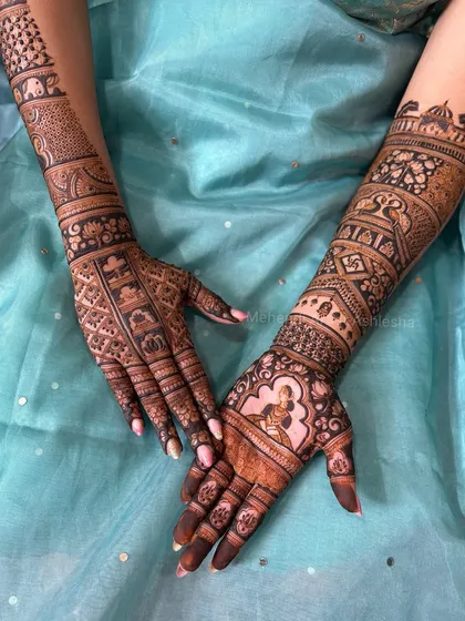 Another look at a custom bridal mehendi with bride and groom figures. The design also includes traditional patterns and symbols, creating a rich and detailed composition.