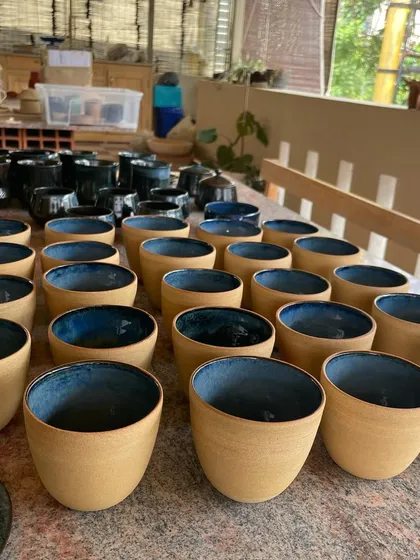 I love the beautiful imperfections that can happen during firing. This batch of stoneware cups and plates came out with a stunning, deep blue glaze that has so much character.