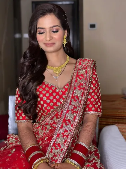 A close-up of Sarika's reception makeup. The soft smokey eye and glowing skin create a look that is both glamorous and timeless.