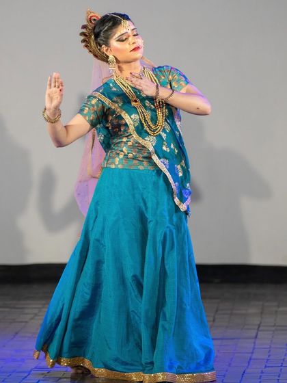 In this moment of abhinaya, I express Radha's longing and her conversation with Krishna. The art of storytelling in Kathak lies in conveying complex emotions through subtle and graceful movements.