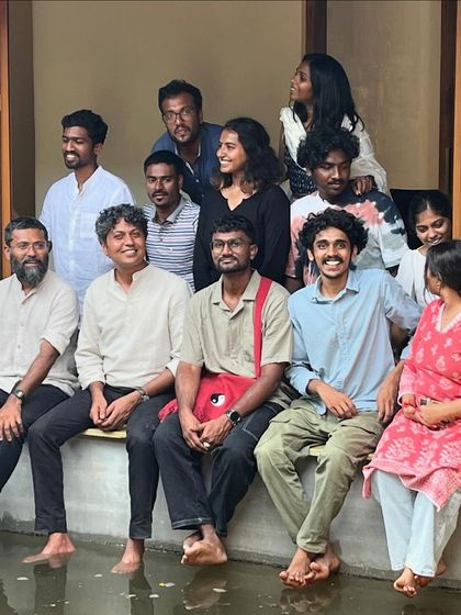 My team and I celebrating the completion of the Malenadu House, cooling our feet in the courtyard's water channel. Every project is a true team effort.