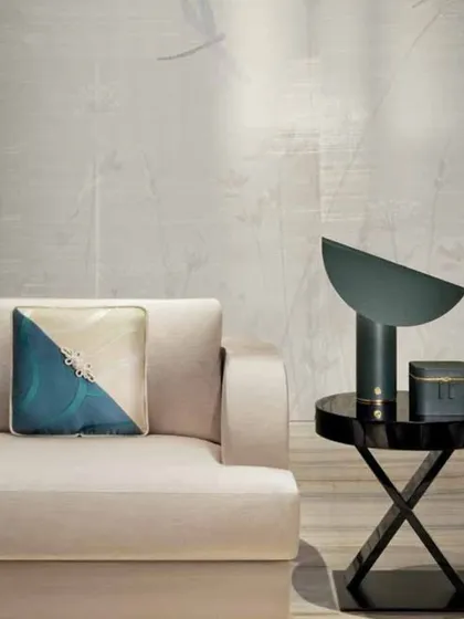 This setting showcases the refined luxury of the Armani Casa 'Inspired Mood' collection. The clean lines of the sofa are complemented by a stunning silk cushion, embodying a sophisticated and timeless style.