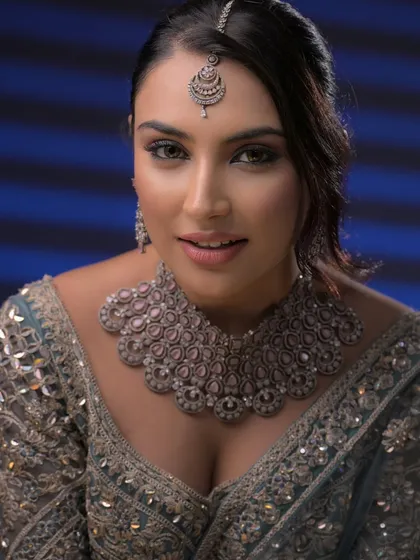 A confident and happy expression. The makeup is designed to be both glamorous and wearable, making the model feel beautiful.