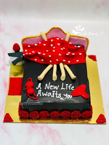 A funny and naughty cake for a bride-to-be, with the message 'A New Life Awaits You'. Perfect for a bachelorette party with a sense of humor.