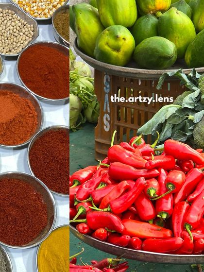 A colorful composition of red chilli powder, whole chillies, and green papayas at a bustling market.