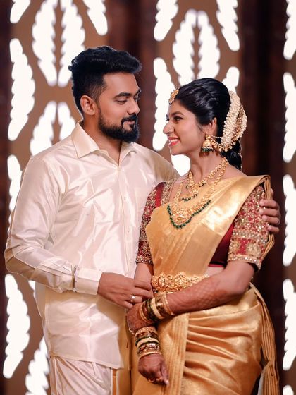 A classic portrait of the wedding couple. The bride's makeup is timeless and elegant, complementing her groom's attire and the overall aesthetic of the wedding.