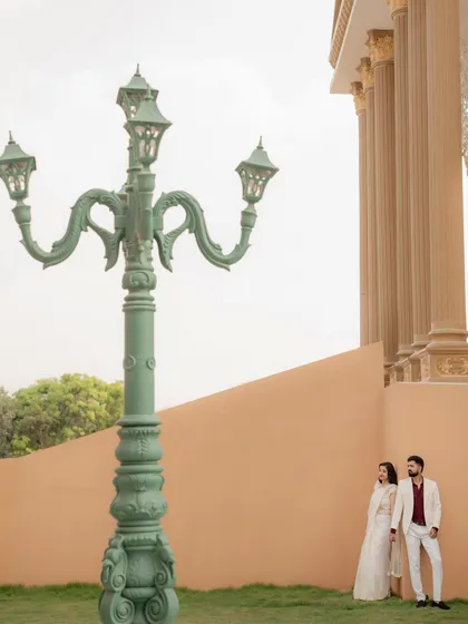 A wide shot that uses a vintage-style lamp post to create an interesting foreground element. I often use environmental details to compose more artistic and visually engaging photos.