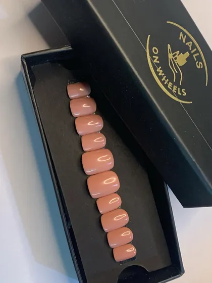 Another look at the 'Smoothie' nude press-on nails, shown here in our signature 'Nails on Wheels' packaging. These sets are always in stock for when you need a beautiful manicure in a hurry.