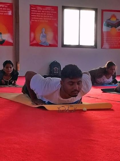 A participant in our Ahmednagar workshop practices Bhujangasana (Cobra Pose). His focus and dedication are a testament to the power of the human spirit to embrace transformation.