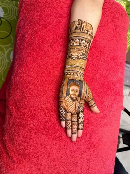 A single hand portrait of a groom, perfect for the bride who wants to keep her partner close. The arm features traditional elephant motifs.