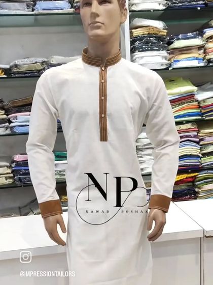 A mannequin displaying a simple white kurta with a contrasting brown collar and cuffs, a classic look for any occasion.