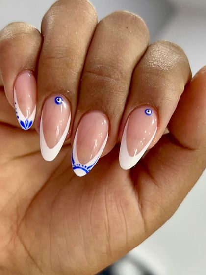 Protected, polished, and powerful. I updated the classic French with intricate blue evil eye designs, adding a touch of symbolic art to a timeless style.