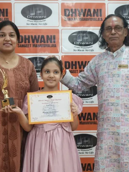 A student with her mother and our senior guru, a moment of pride.