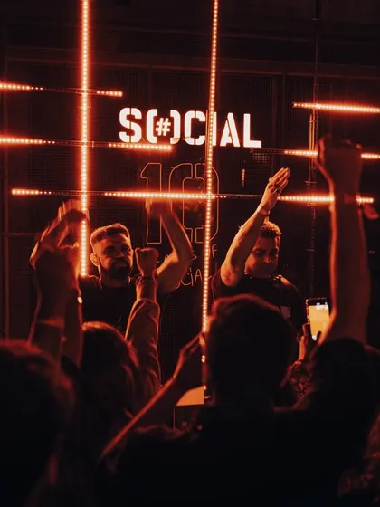A triumphant shot with me and Stoked, hands in the air, celebrating a successful set with the crowd.