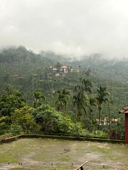 The misty view of our homestay, nestled in the hills.