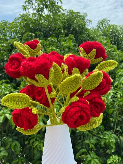 The new multi-head red roses arranged in a vase.