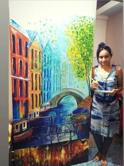Here I am with a large, vibrant landscape painting inspired by the colorful streets of Amsterdam. This piece uses bold colors and reflections to bring a cheerful and bright energy to the room.
