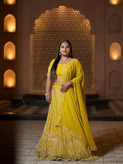 A classic portrait of the bride-to-be. Her makeup is elegant and timeless, with a focus on flawless skin and defined features.