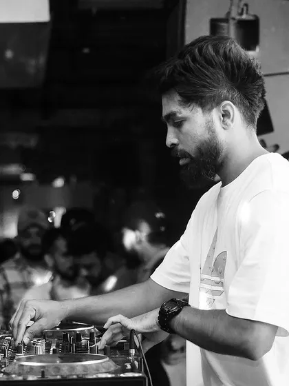 A black and white action shot from my set at Koramangala Social. It captures the intensity and focus of a live performance.