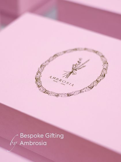 Bespoke Gifting by Ambrosia, where luxury meets thoughtfulness. Our elegant pink boxes with gold foil logos are perfect for creating a high-end gifting experience.