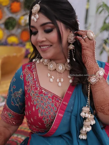 A stunning Haldi look for my bride. The makeup features smokey eyes and a flawless base, which beautifully contrasts with her unique shell jewelry.
