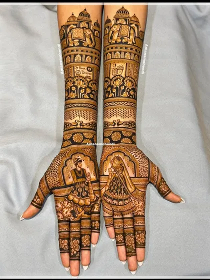 A mesmerizing bridal design featuring royal elephants, grand palaces, and beautiful peacocks. The palms are dedicated to portraits of the bride and groom, creating a perfect blend of tradition and love.