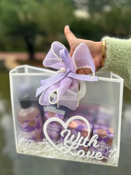 A "With Love" hamper in a clear acrylic bag with a beautiful lavender bow. The details make the gift special.
