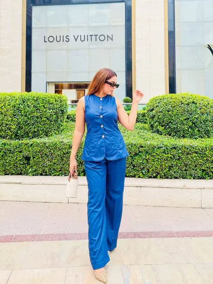 Power dressing is not just about blazers. This structured denim co-ord set is a perfect summer alternative, offering a sharp silhouette with its straight wide-leg pants and darted top, creating a look of effortless authority.